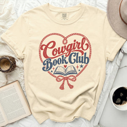 Cream t-shirt with "Cowgirl Book Club" graphic in a heart shape.