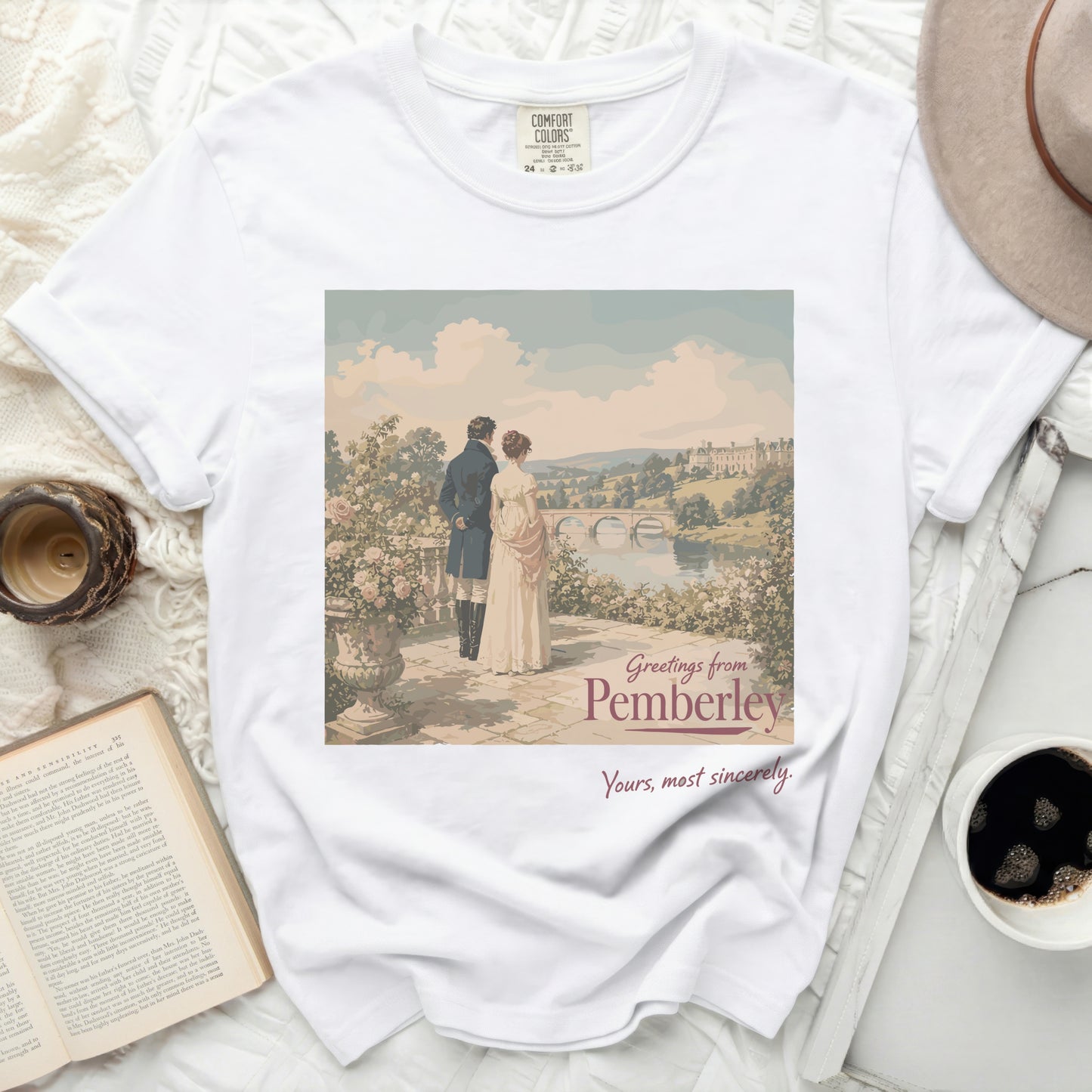 White t-shirt with "Greetings from Pemberley" artwork.