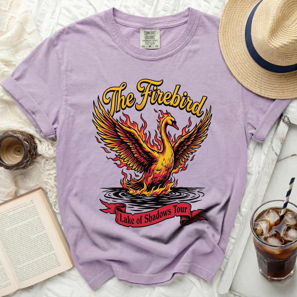 Purple t-shirt with "The Firebird" and "Lake of Shadows Tour" graphic.