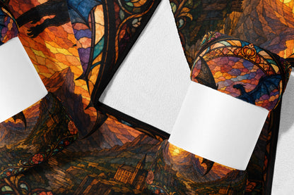 Dragon and castle in stained glass pattern with sunset over mountains.