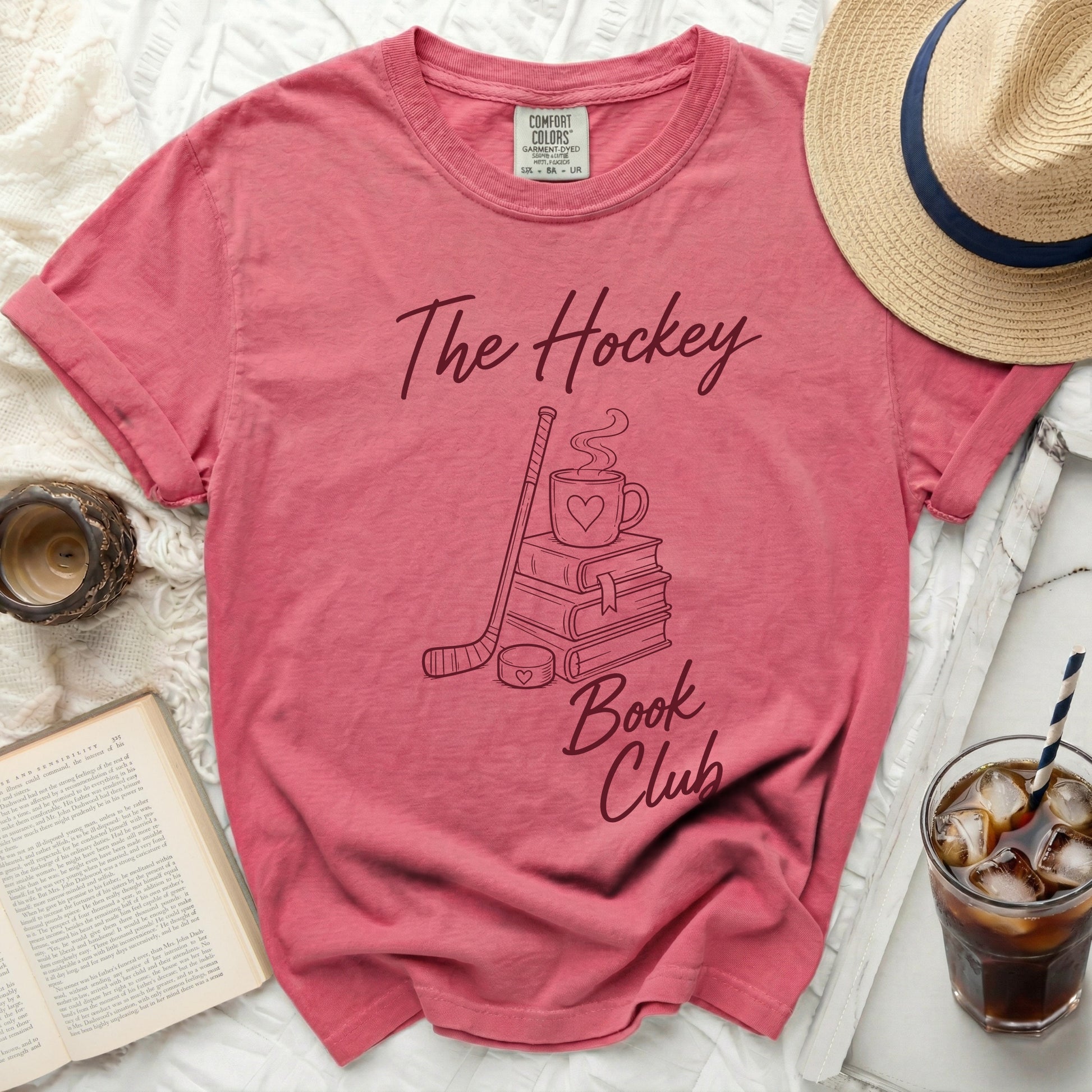 Pink t-shirt with "The Hockey Book Club" text and graphic.