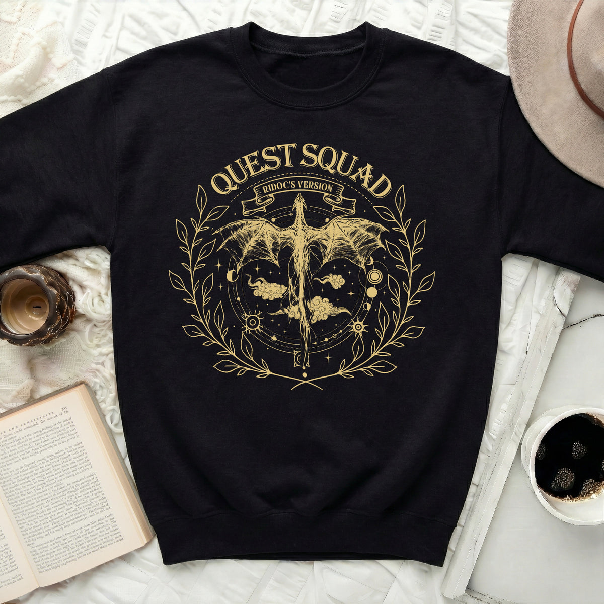 Black sweatshirt with gold "Quest Squad Ridoc's Version" dragon graphic.