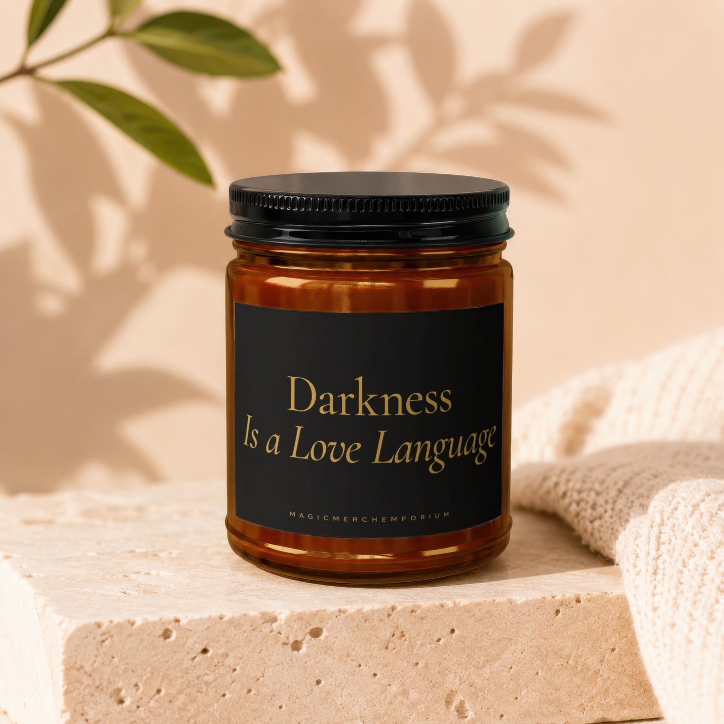 Candle with black label reading "Darkness Is a Love Language" and "MagicMerchEmporium".