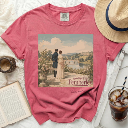 Pink t-shirt with "Greetings from Pemberley" graphic of couple.