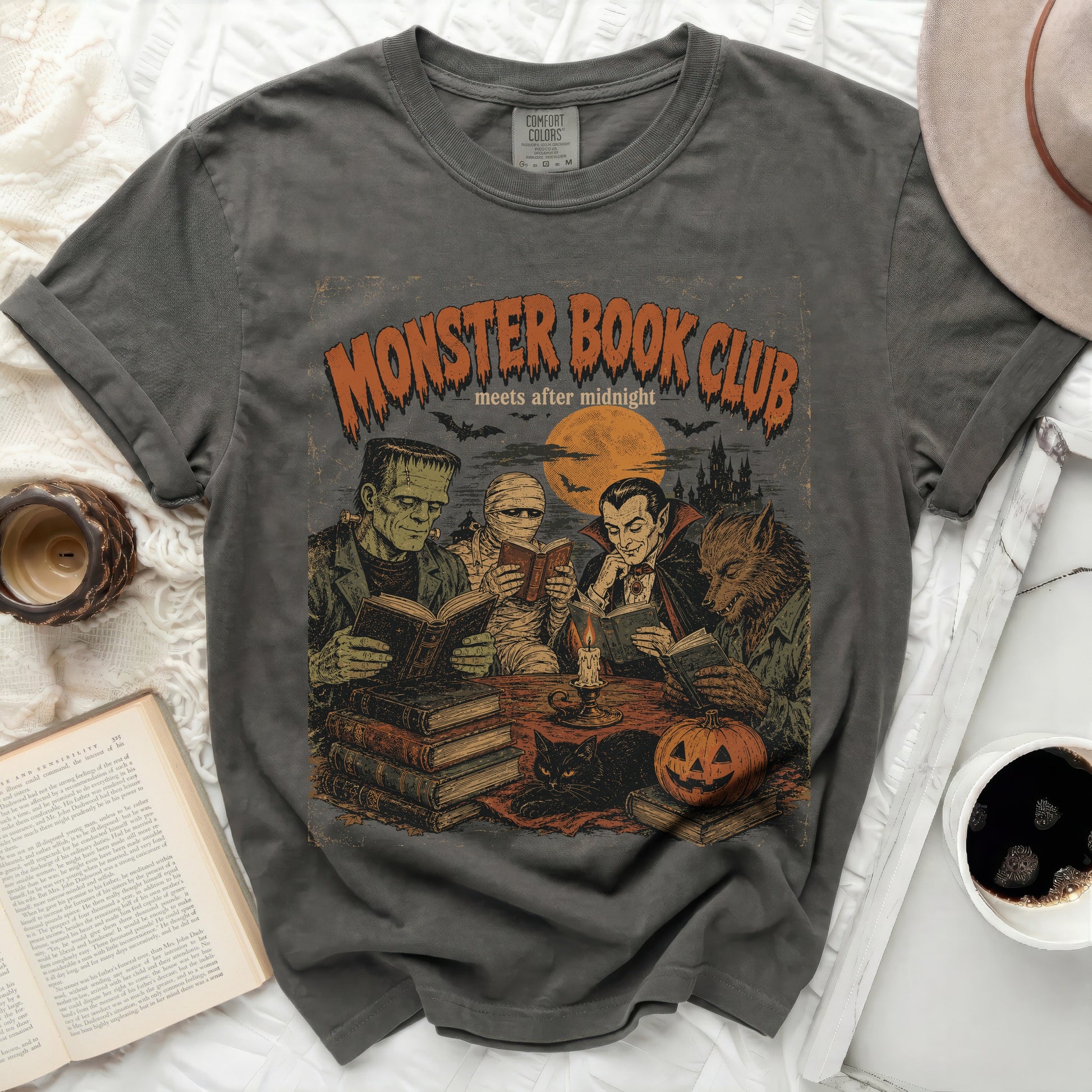 Monster Book Club meets after midnight graphic tee with Frankenstein, mummy, vampire, werewolf.