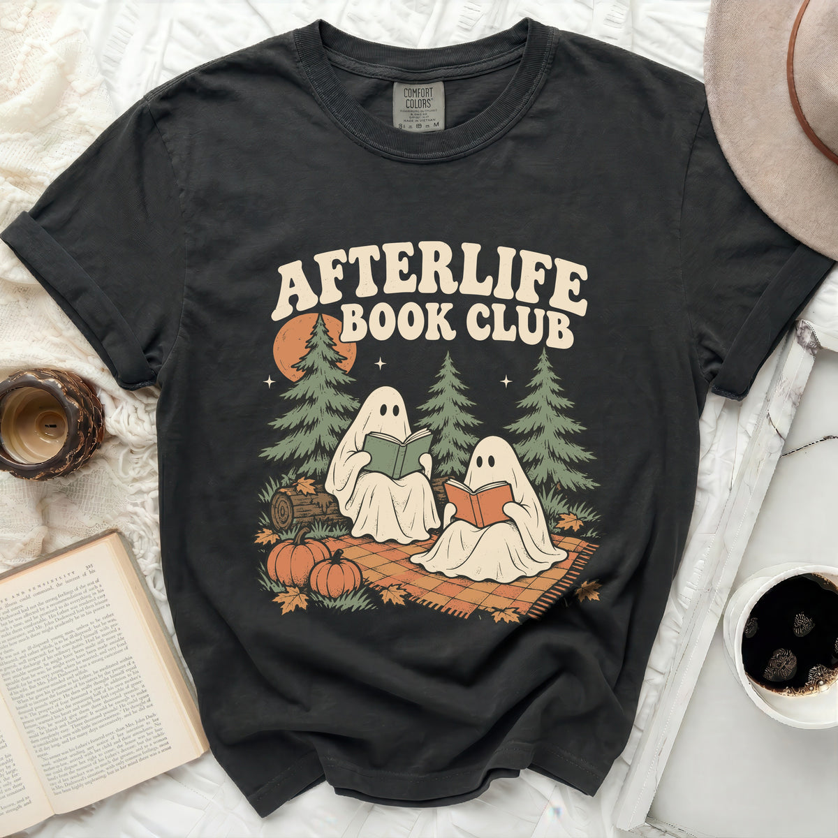 Black Comfort Colors t-shirt with "Afterlife Book Club" graphic featuring ghosts reading books.