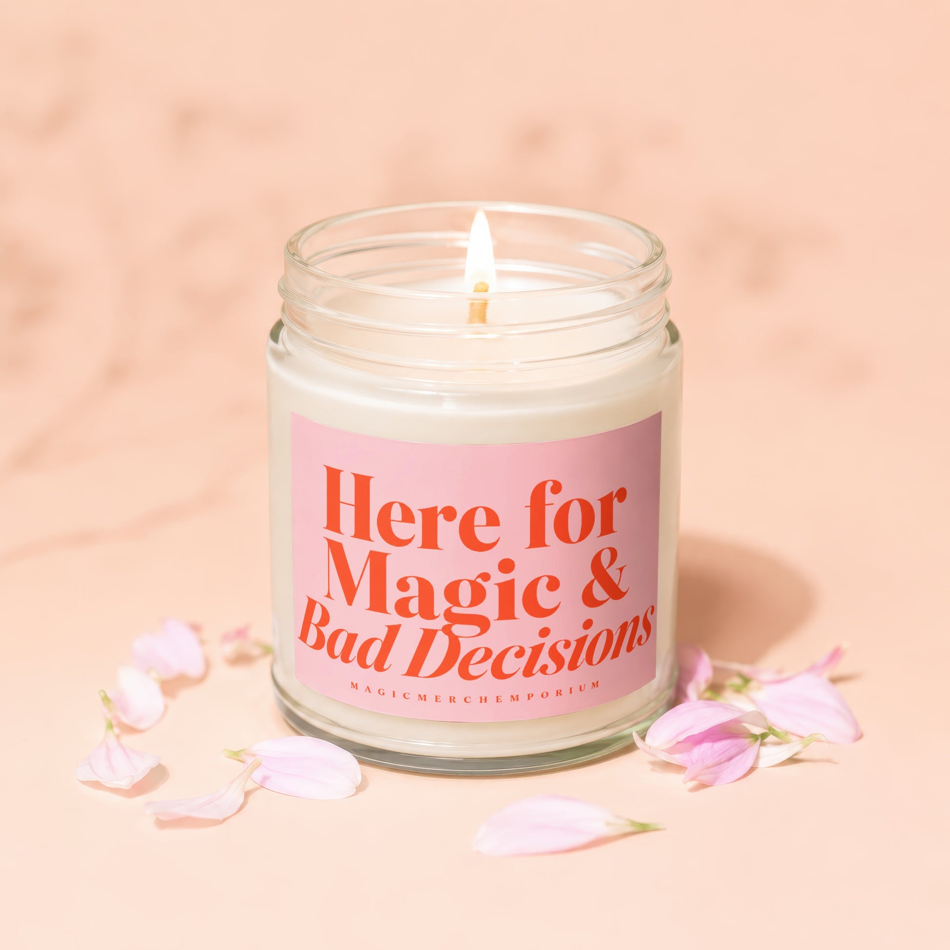 Jar candle with pink label reading "Here for Magic & Bad Decisions."