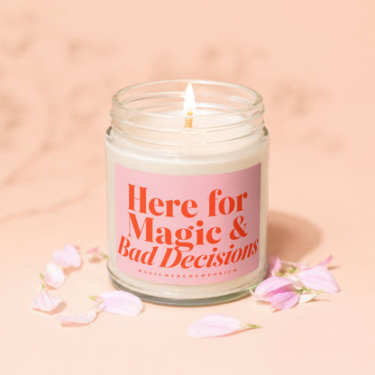 Jar candle with pink label reading "Here for Magic & Bad Decisions."