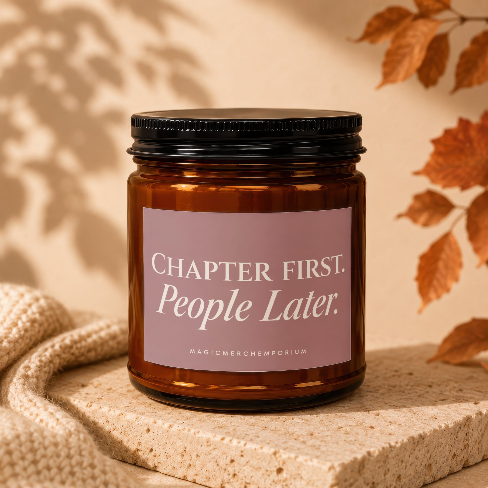 Amber candle with label reading "CHAPTER FIRST. People Later."