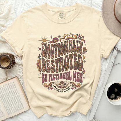 Cream t-shirt with "Emotionally Destroyed by Fictional Men" graphic.