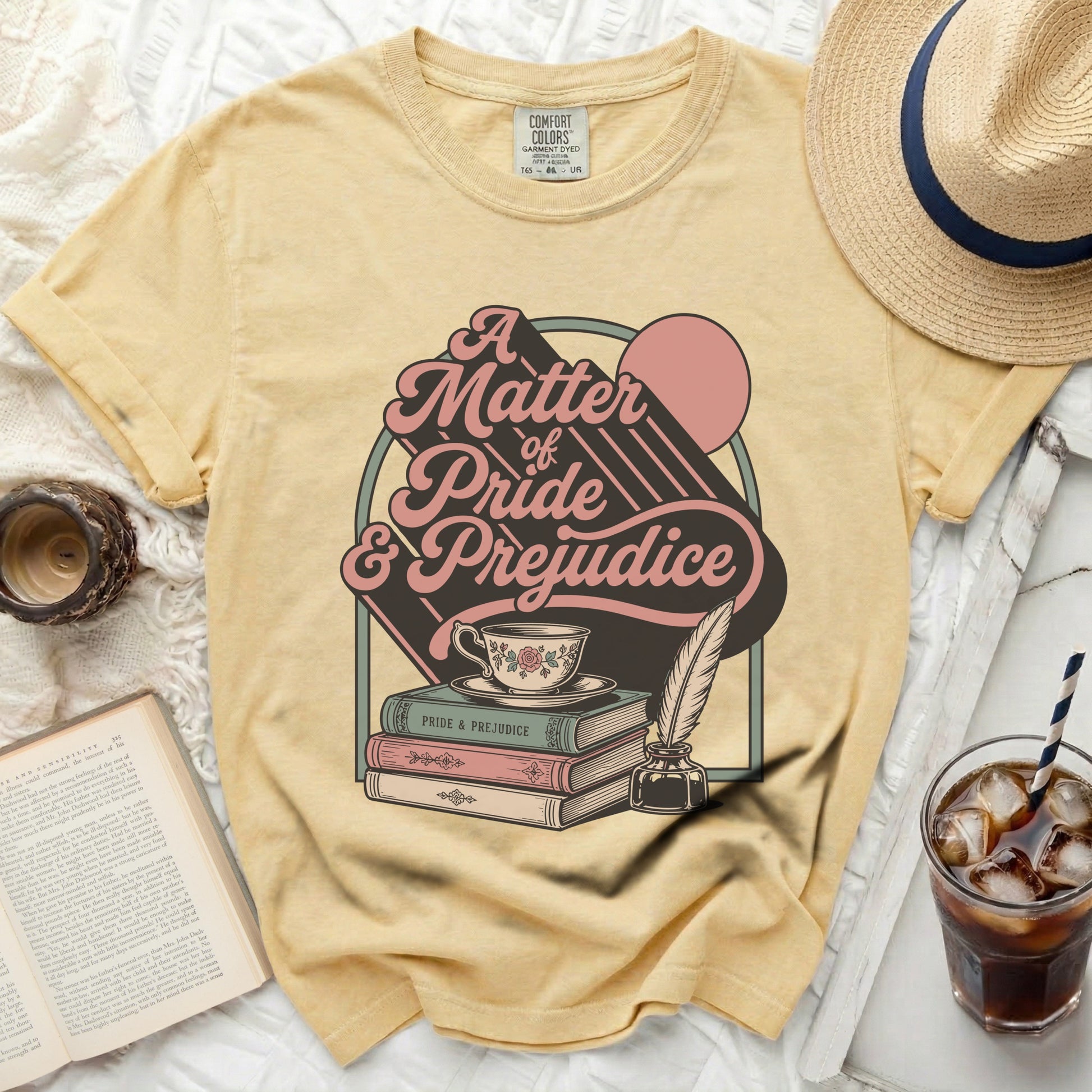 Yellow t-shirt with "A Matter of Pride & Prejudice" graphic and books.