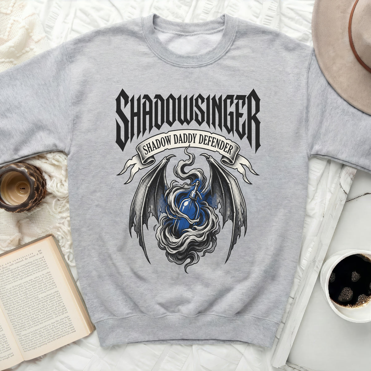 Grey sweatshirt with "Shadowsinger Shadow Daddy Defender" graphic.