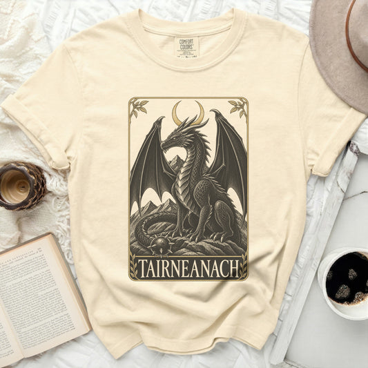 A cream Comfort Colors t-shirt with a black dragon design and text "TAIRNEANACH".