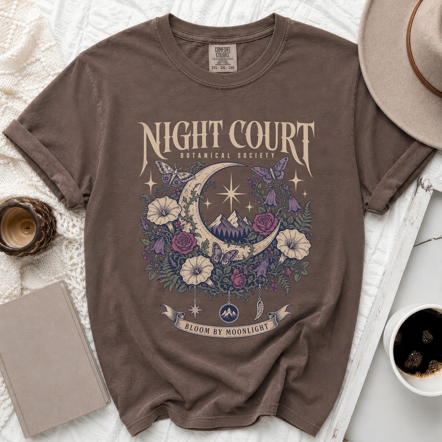 Brown t-shirt with "Night Court Botanical Society Bloom by Moonlight" graphic.