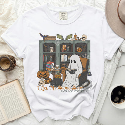 White t-shirt with "I Like My Books Spicy And My Coffee Icy" Halloween graphic.