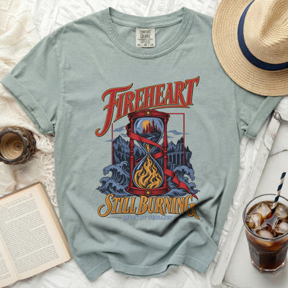 Light blue t-shirt with "Fireheart Still Burning Queen of Terrasen" graphic.