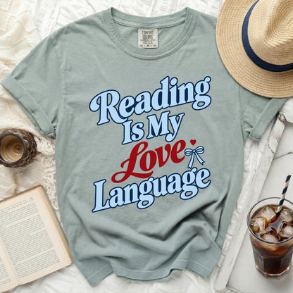 Light blue t-shirt with "Reading Is My Love Language" text in blue and red.
