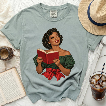 T-shirt with retro illustration of a woman reading a book and a red bow.