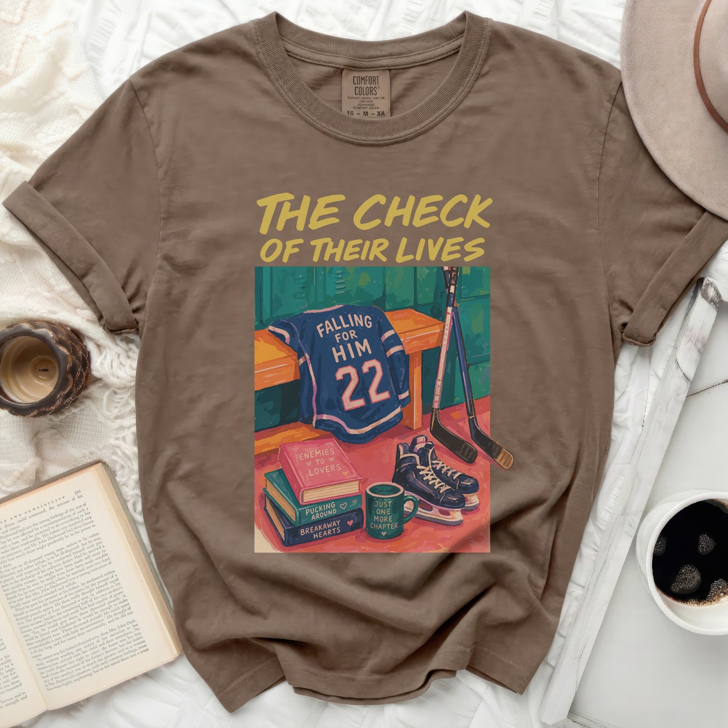 Brown t-shirt with "The Check of Their Lives" text and hockey graphic.