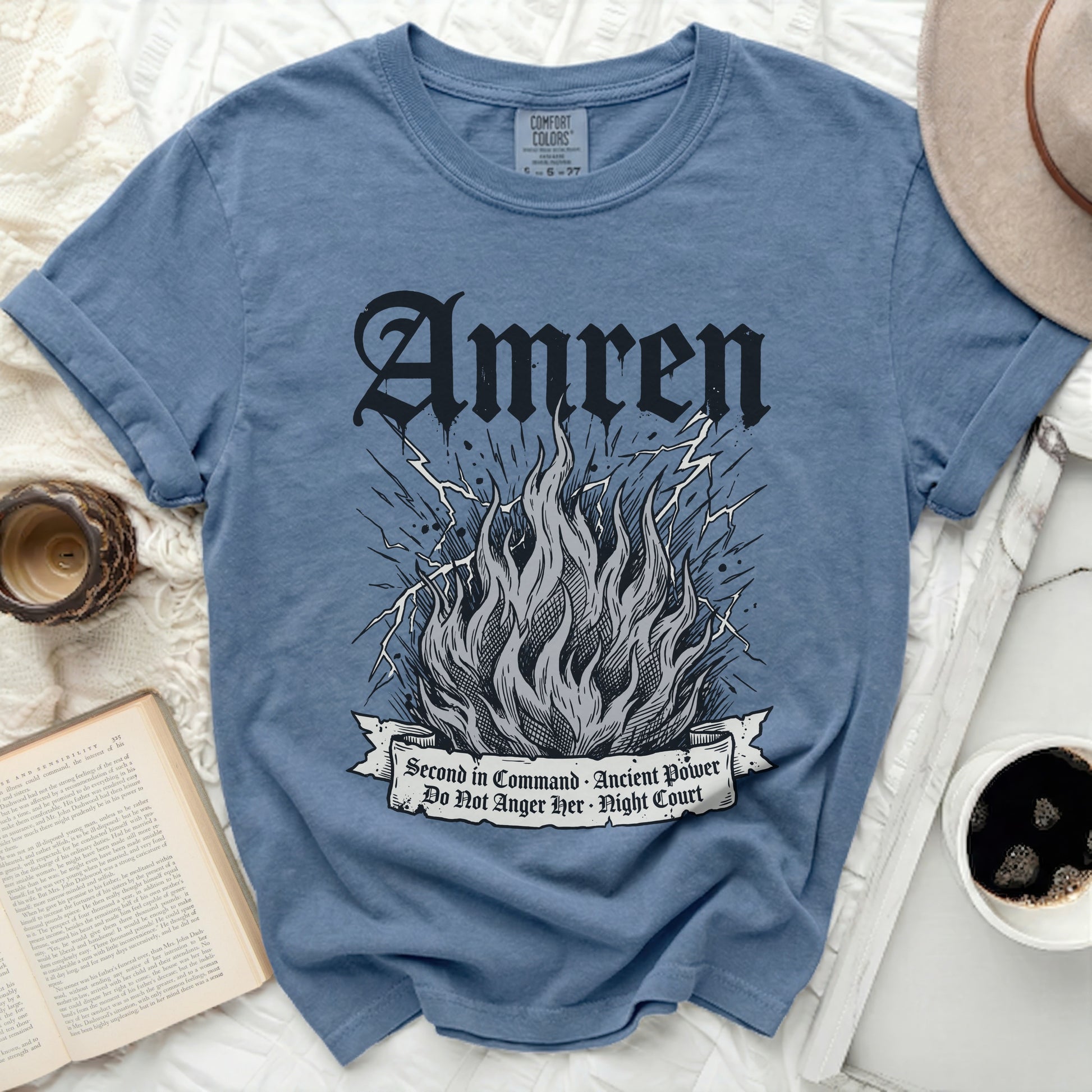 Blue t-shirt with gothic font "Amren" and flaming fire graphic.