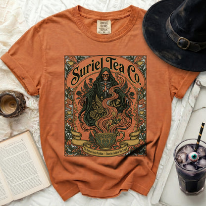 Orange t-shirt with Grim Reaper design and text "Suriel Tea Co. The Hottest Tea in Prythian - Since the Cauldron Was Forged."