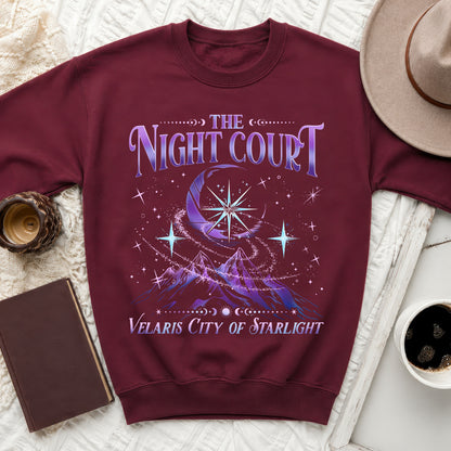 Maroon sweatshirt with "The Night Court Velaris City of Starlight" text and celestial mountain graphic.