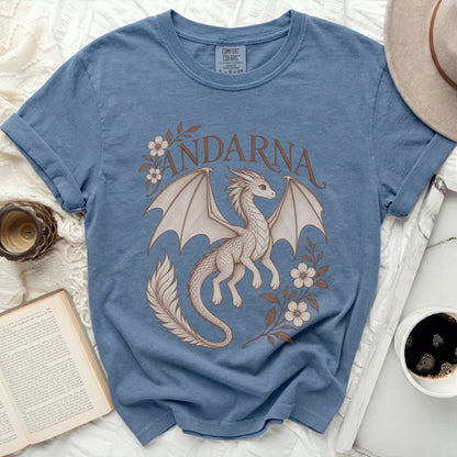 Blue crewneck t-shirt featuring a brown graphic of a dragon, flowers, and the word Andarna.
