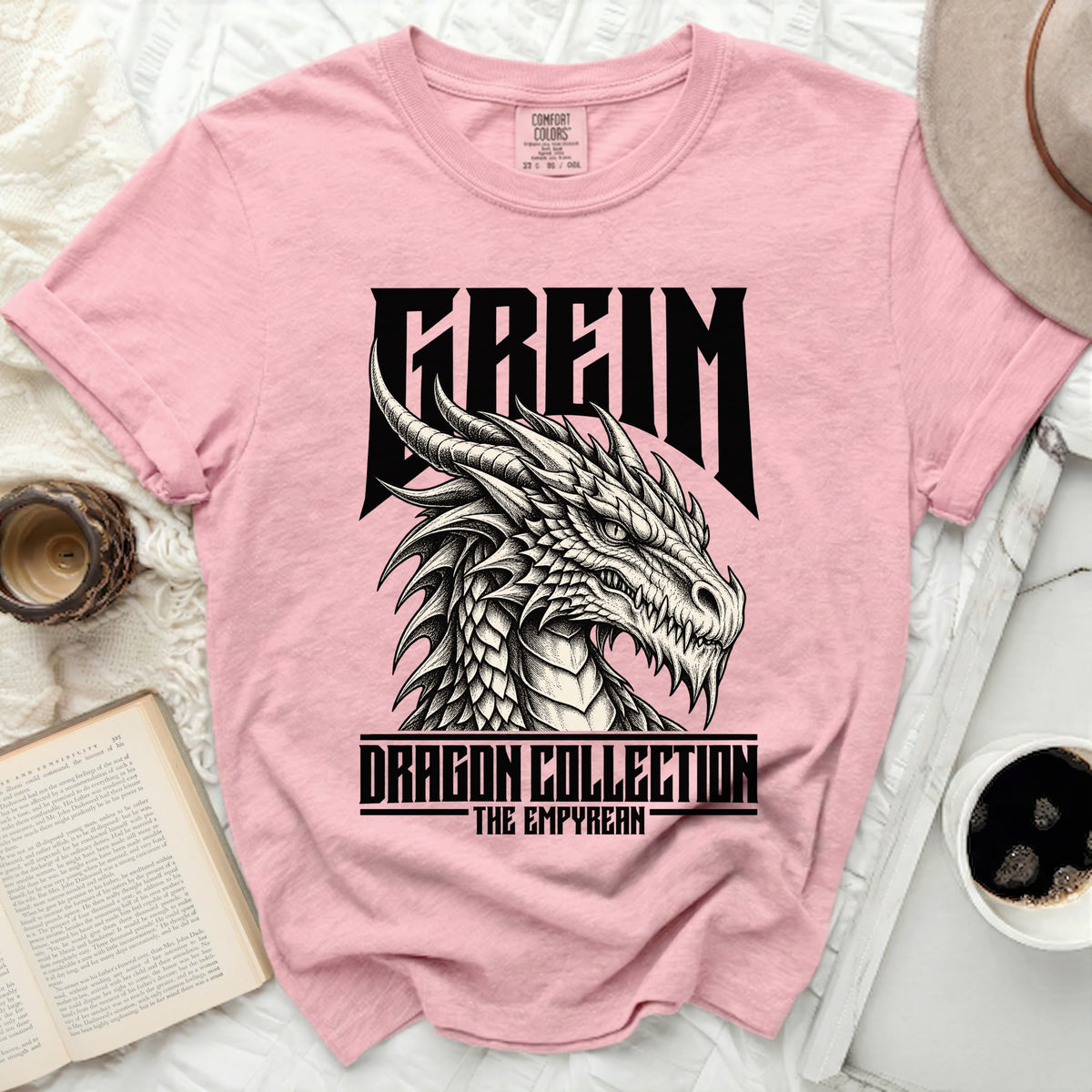 Pink t-shirt with black dragon graphic and text "FREIM DRAGON COLLECTION THE EMPYREAN".