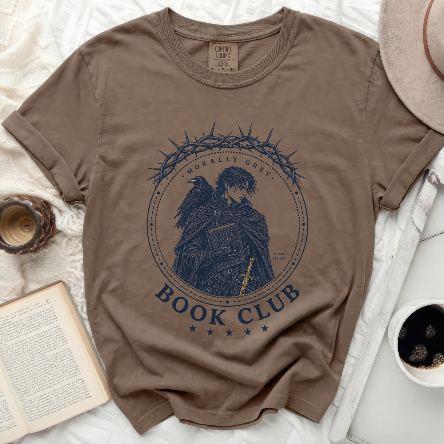 Brown t-shirt with "Morally Grey Book Club" circular graphic.