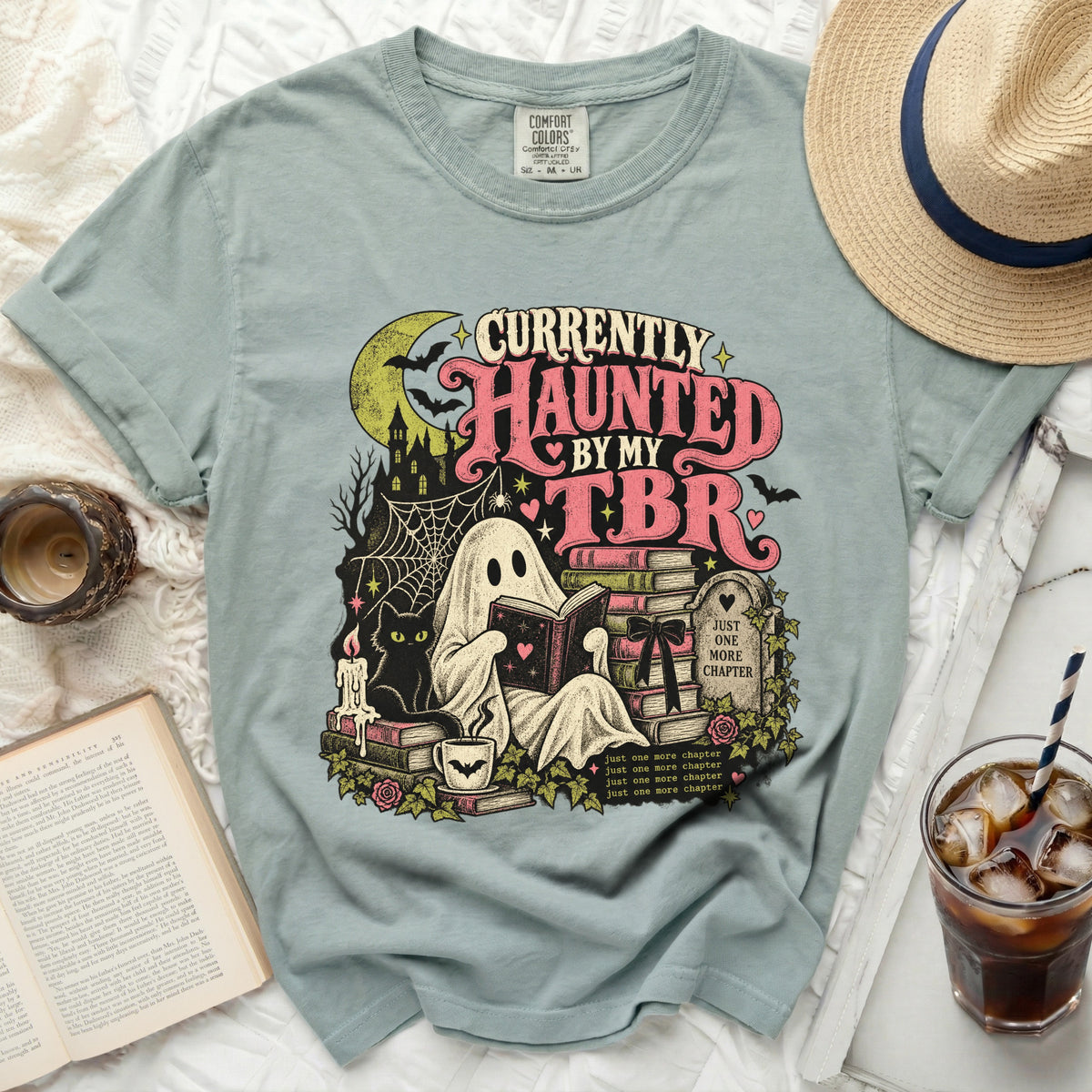 Ghost reading books with text "Currently Haunted by My TBR" and "Just One More Chapter".