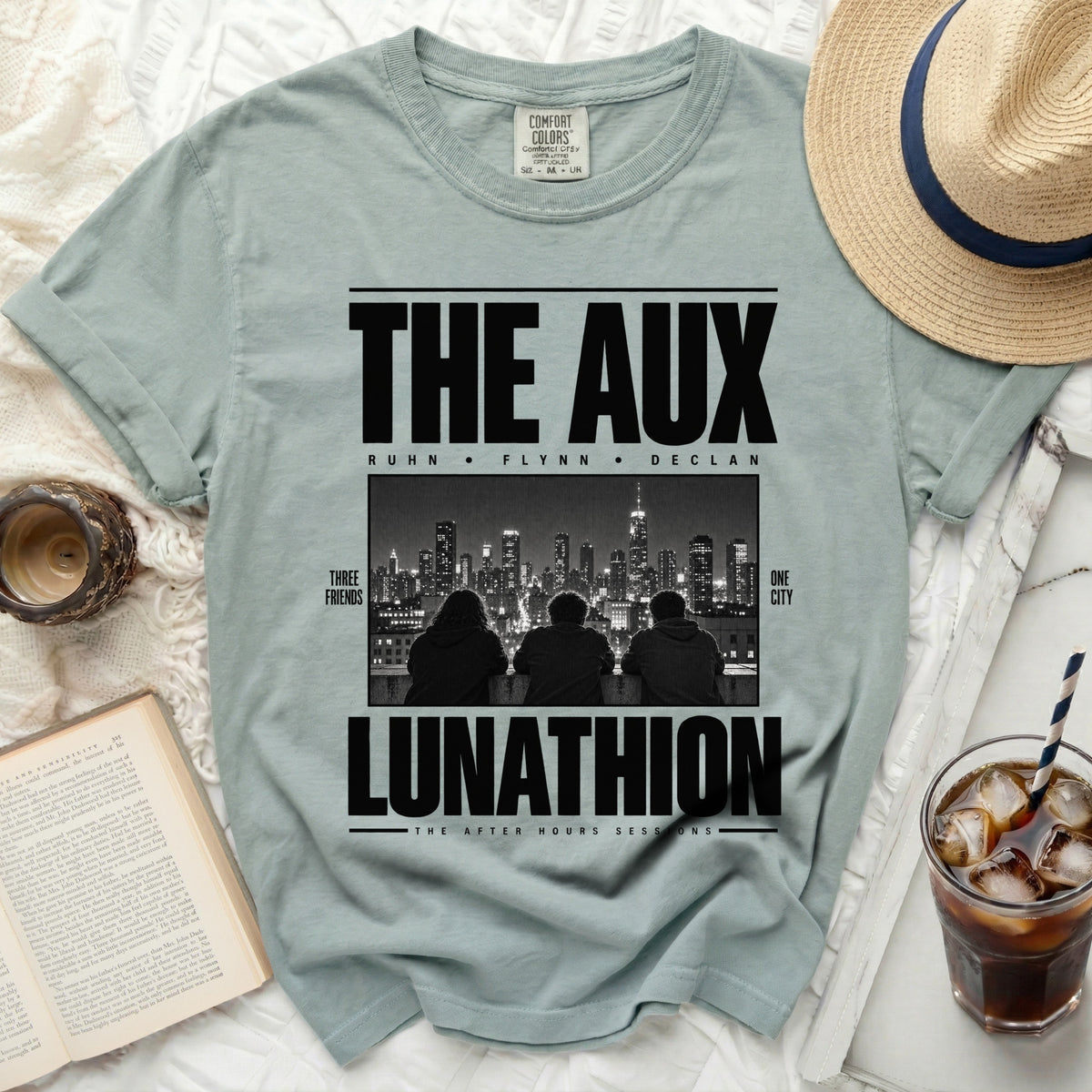 The Aux t-shirt with "Three Friends One City" and "Lunathion" text.