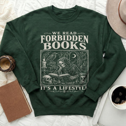 Dark green sweatshirt with "We Read Forbidden Books It's a Lifestyle" and grim reaper reading design.