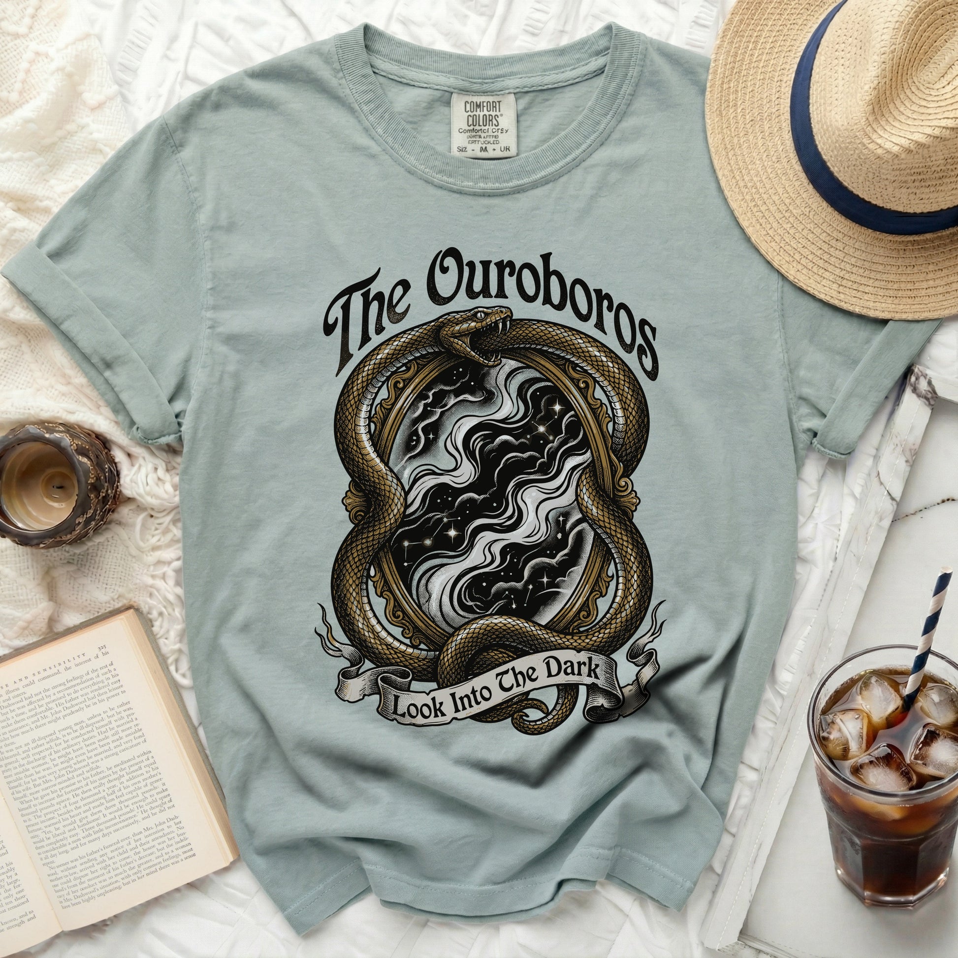 The Ouroboros snake around a mirror with text "Look Into The Dark".