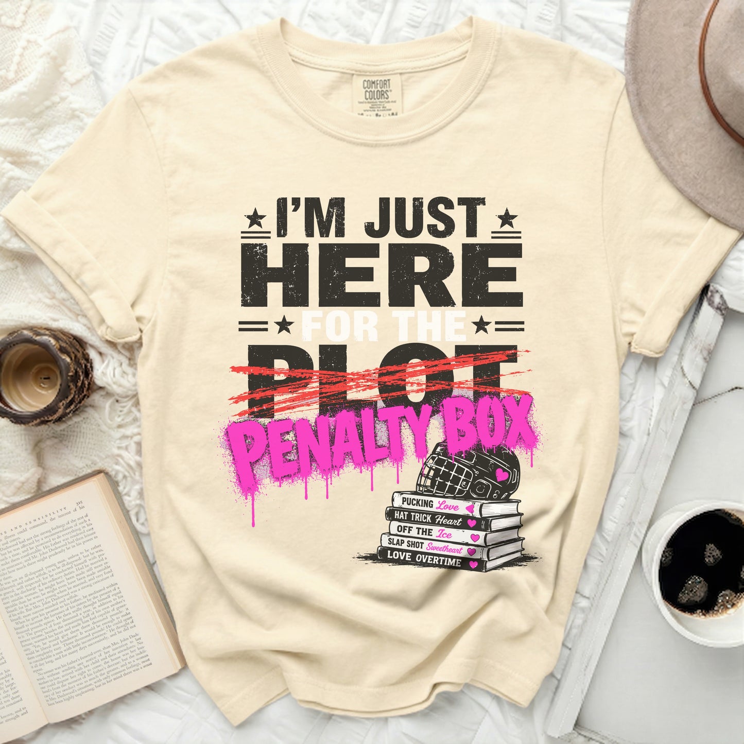 Cream t-shirt with "I'm Just Here for the Penalty Box" graphic.