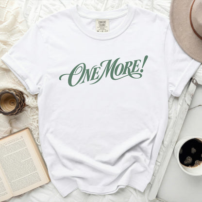 White Comfort Colors t-shirt with "ONE MORE!" graphic in green script.