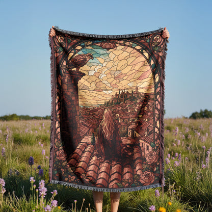 A person holds up a large, colorful tapestry depicting a woman sitting on a rooftop, overlooking a cityscape.