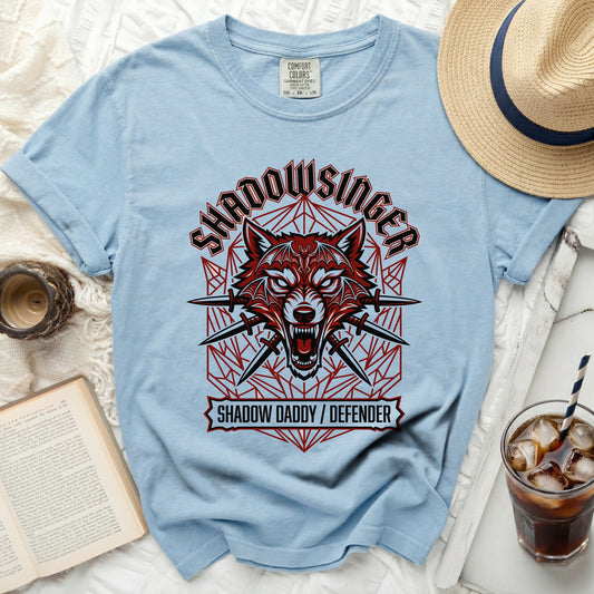 Light blue t-shirt with red and black wolf graphic and text.