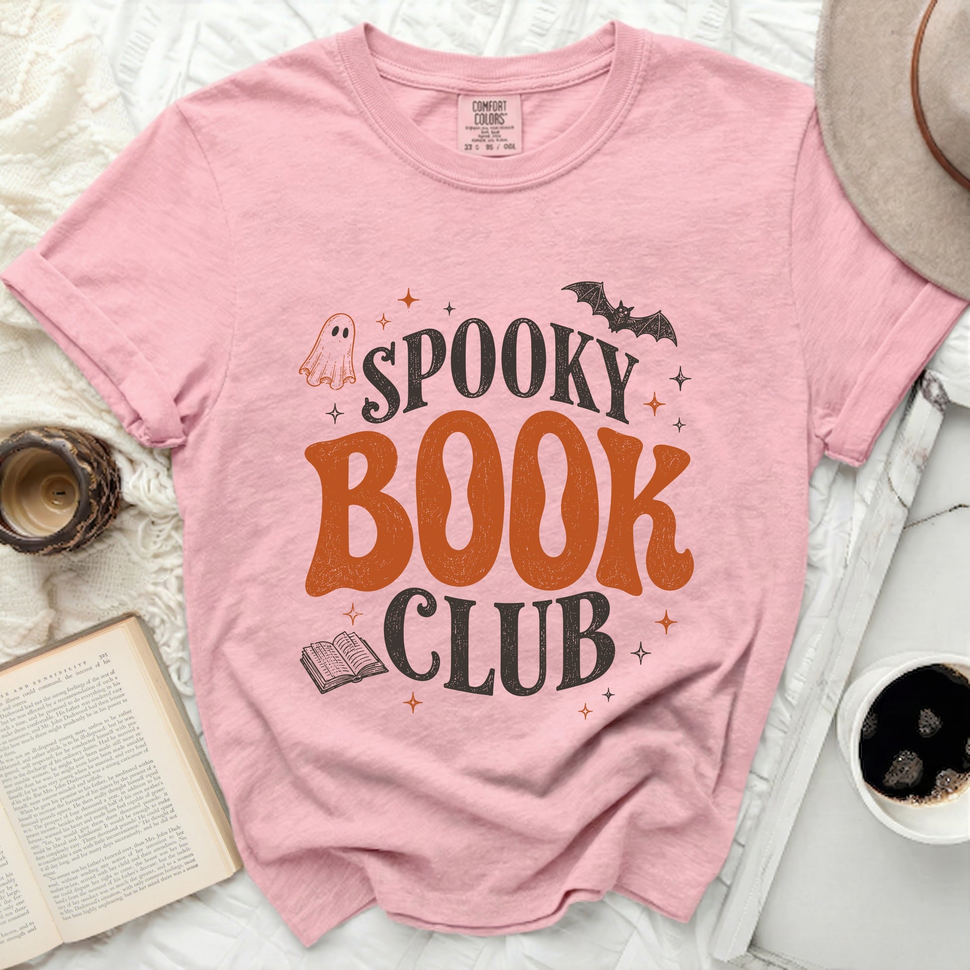Pink t-shirt with "Spooky Book Club" Halloween graphic.