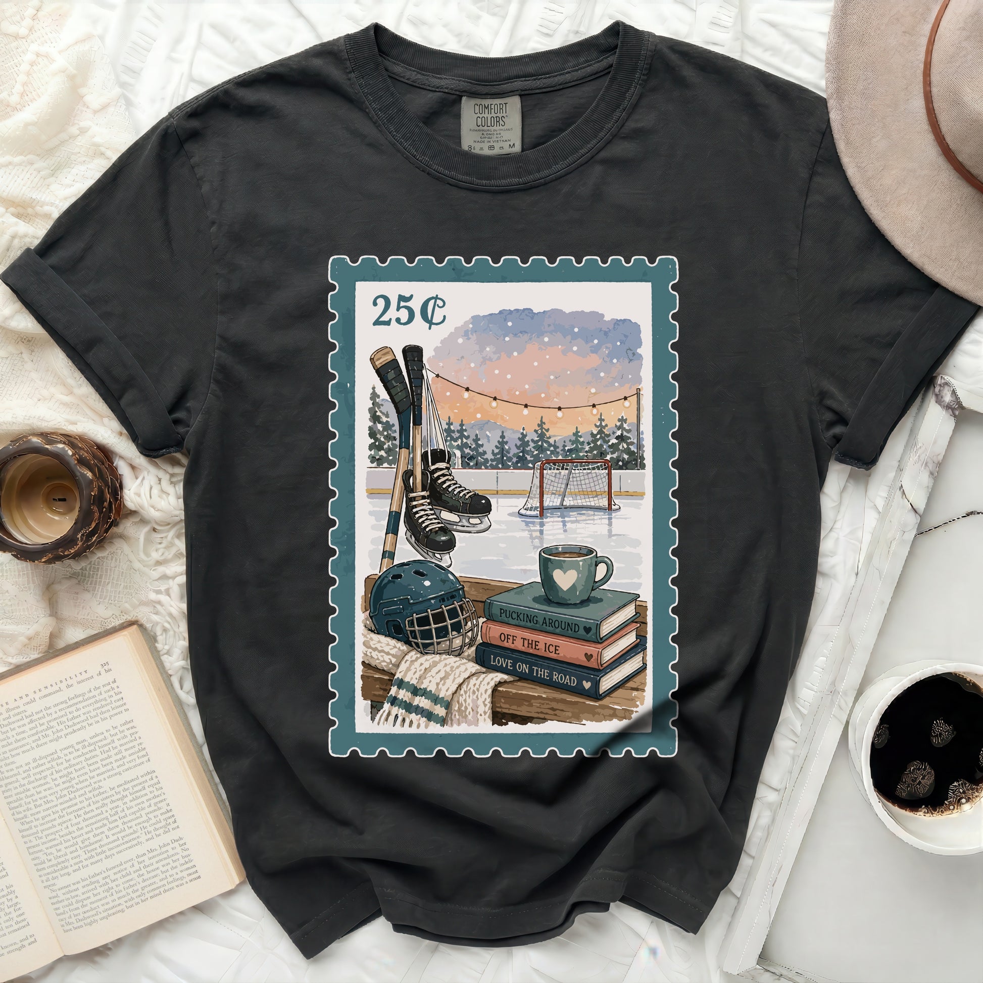 T-shirt with postage stamp graphic of ice hockey scene and books.