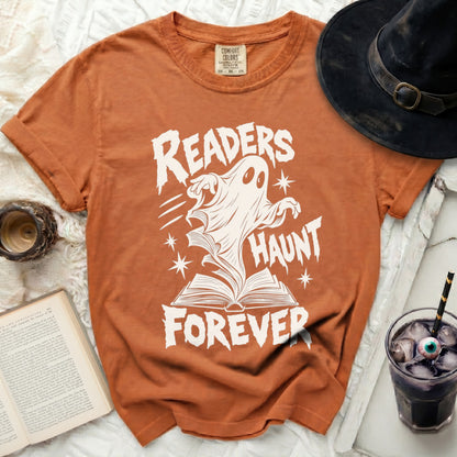 Orange t-shirt with white "Readers Haunt Forever" ghost and book graphic.