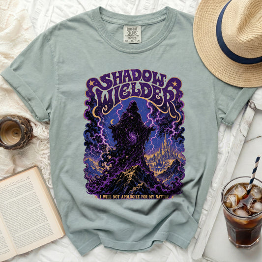 Light green t-shirt with "Shadow Wielder" graphic and quote.