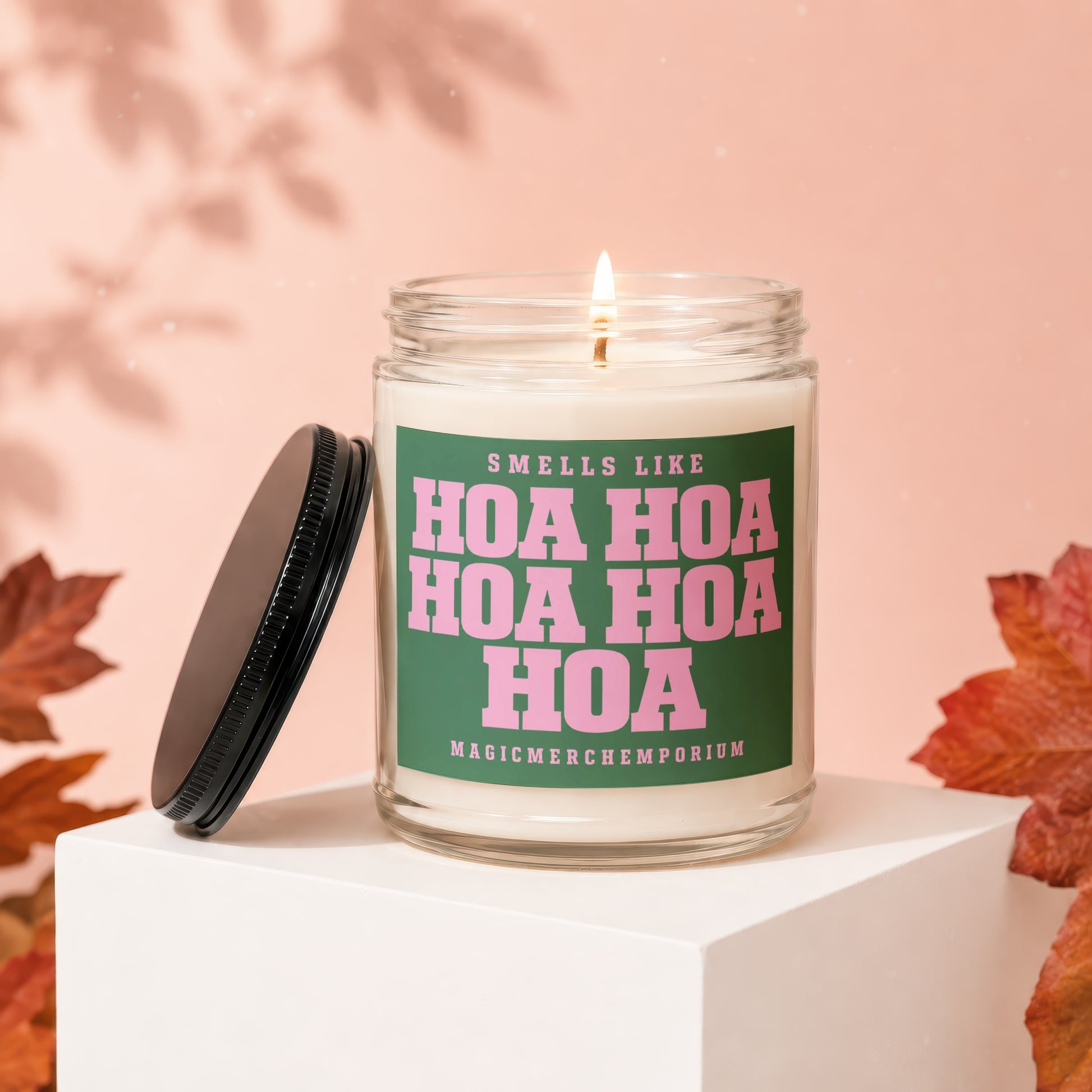 Scented candle with a green label that reads "Smells Like Hoa Hoa Hoa Hoa Hoa"