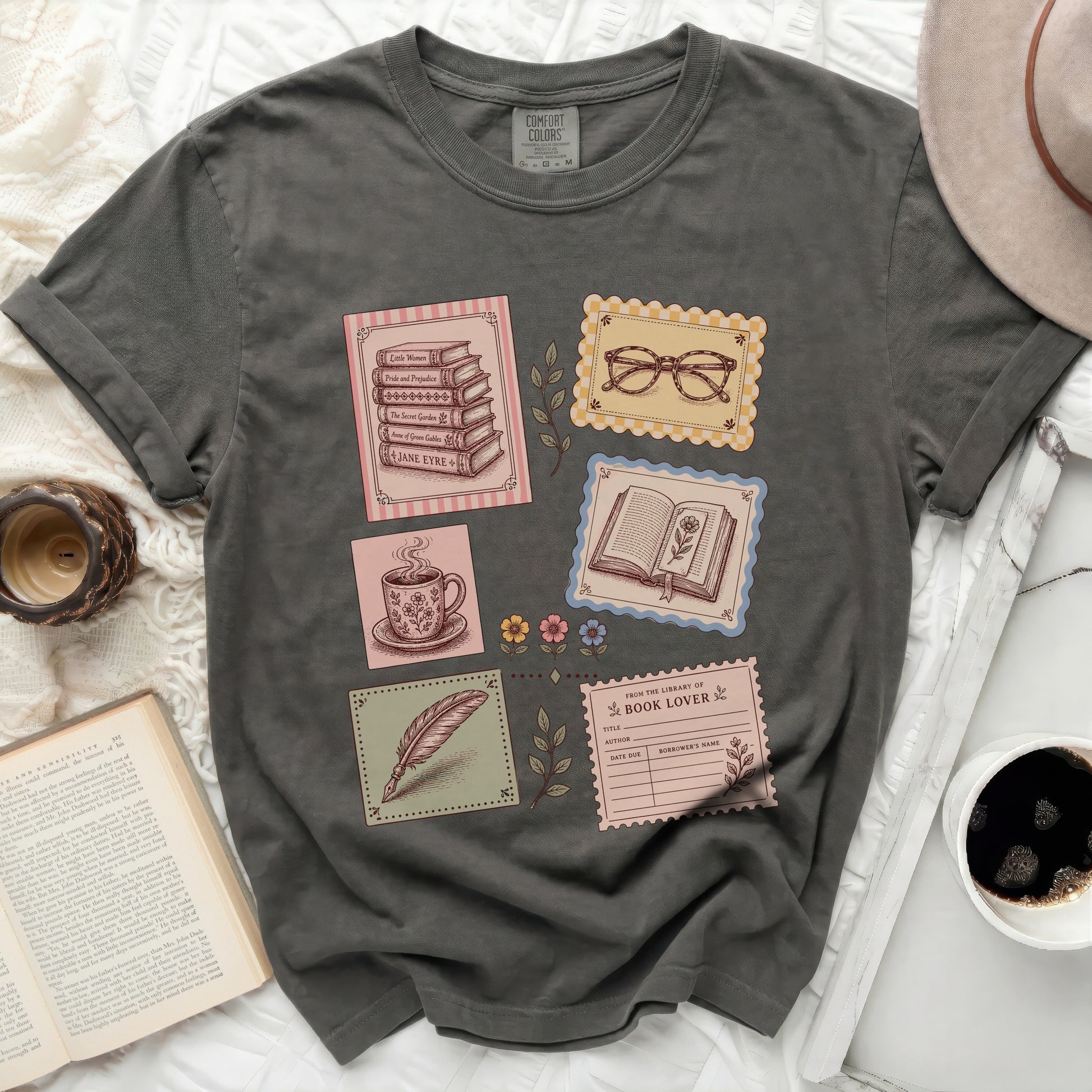 T-shirt with library-themed vintage illustrations and book titles.