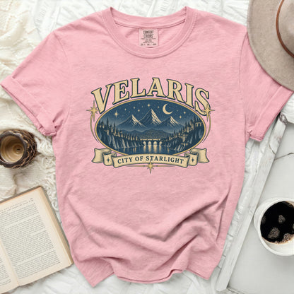 Pink t-shirt with "Velaris City of Starlight" graphic featuring a cityscape at night.