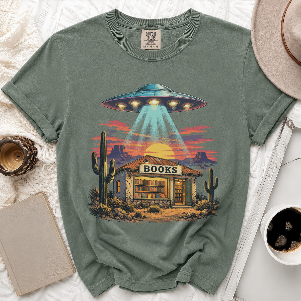 UFO beam shines on desert bookstore with "BOOKS" sign.