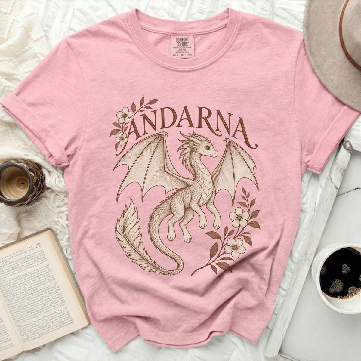 Pink Comfort Colors t-shirt featuring a brown vintage-style illustration of a dragon and flowers with the text ANDARNA.