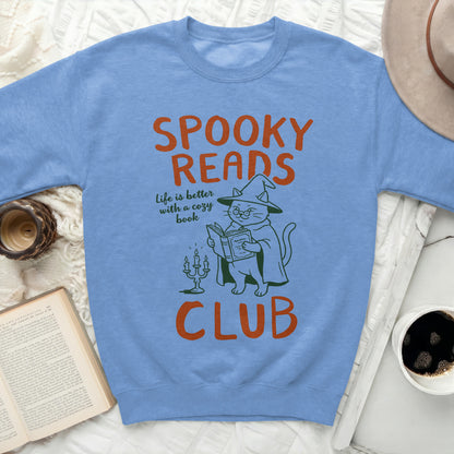Light blue sweatshirt with "SPOOKY READS CLUB" and a witch cat.