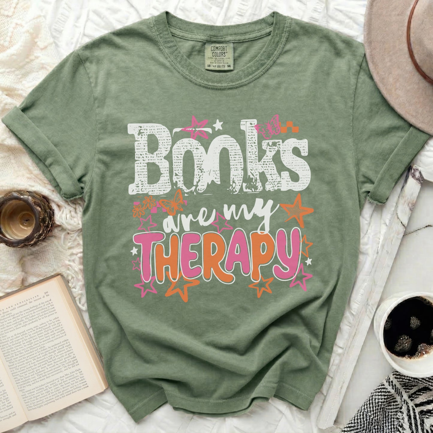 Green t-shirt with "Books are my Therapy" text and butterflies.
