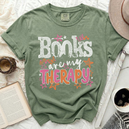 Green t-shirt with "Books are my Therapy" text and butterflies.