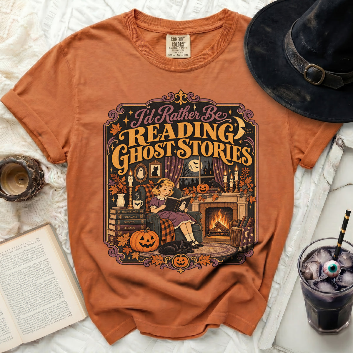 Orange t-shirt with "I'd Rather Be Reading Ghost Stories" Halloween graphic.